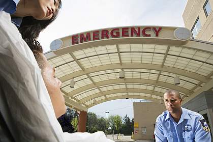 Paramedics wheeling patient into hospital