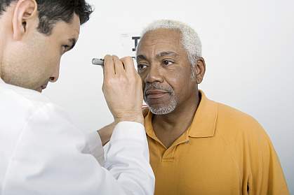 African American man getting eye exam