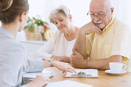 Senior couple making a decision with an advisor
