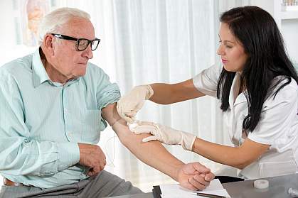 Older man getting blood drawn