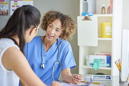 Female doctor talking to woman