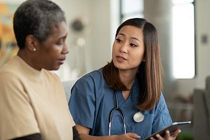 Doctor speaking with elderly patient