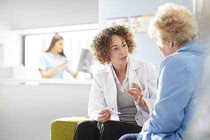 Doctor speaking with older woman
