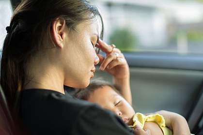 Stressed mom trying to nap with baby in car
