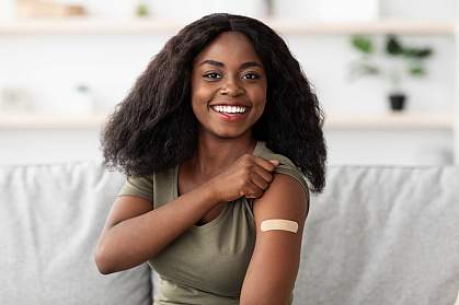 Young black woman with bandage from vaccination