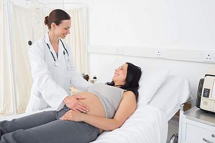 Female doctor with a pregnant woman in an examination room
