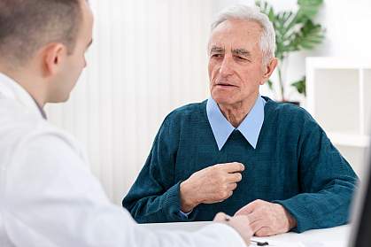 Older man talking to a doctor