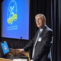 A photo of Dr. Francis Collins speaking at the NIAMS 25th Anniversary Scientific Symposium.