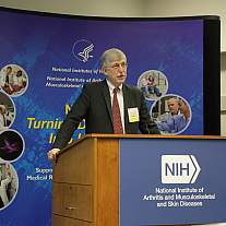 Dr. Collins speaks at an Outreach and Education Day event.
