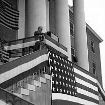 President Roosevelt speaking on the steps of Building 1.