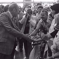 President Gerald Ford shakes hands with NIH staff, patients, and guests at the Clinical Center.