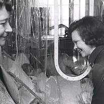 Two women speaking in a laboratory