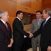 President George W. Bush and Dr. Elias Zerhouni shake hands.