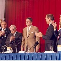 President Ronald Reagan, HHS Secretary Otis R. Bowen, Dr. James B. Wyngaarden and members of the Commission on the Human Immunodeficiency Virus Epidemic. 