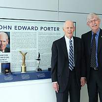 Congressman John Edward Porter (left) and NIH Director Dr. Francis Collins pose next to an exhibit honoring the Congressman’s strong leadership on behalf of NIH research.