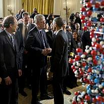 President Obama speaks with Dr. Collins.