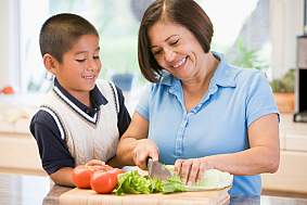 Grandmother And Grandson Preparing meal,mealtime Together