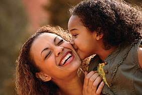 Mother and daughter laughing together.