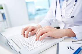 Doctor on a computer