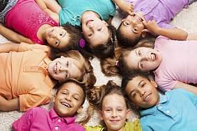 Diverse kids in a circle.