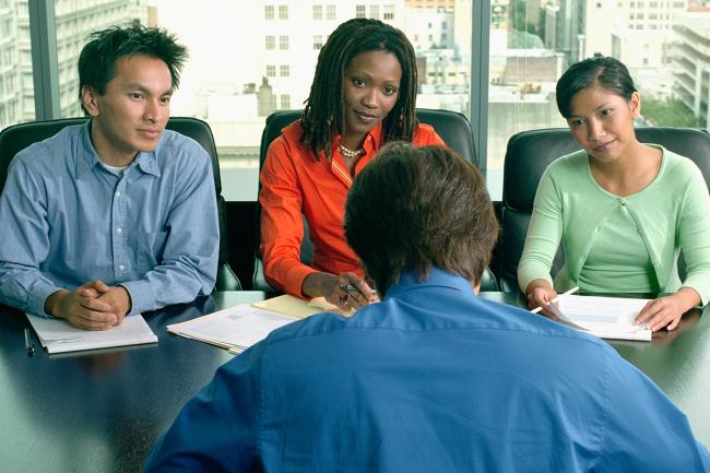 Several people at a conference table