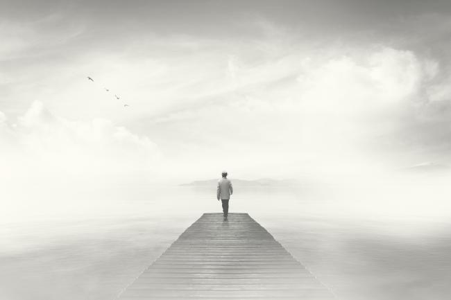 20191001-sleep.jpg Dream-like photo of man reaching the end of a boardwalk in heavy fog