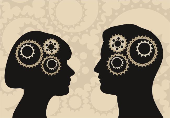 Silhouettes of a man and woman with gears in their heads