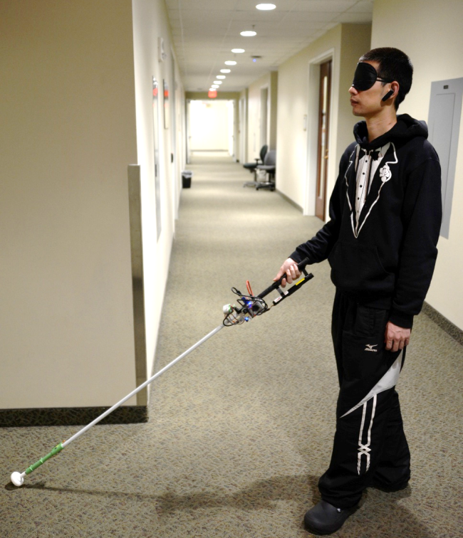 Person tests robotic cane