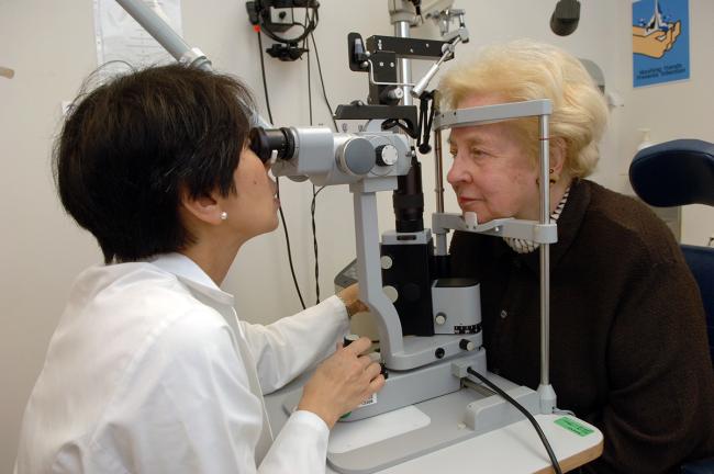 Image of a doctor giving an eye exam