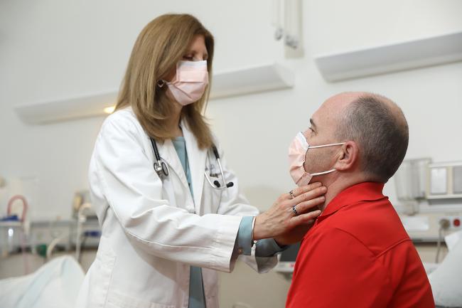A doctor examining a patient