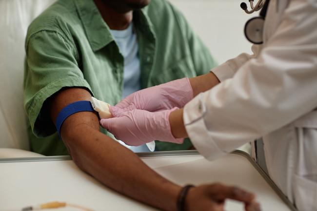 Nurse preparing a patient's arm for a blood test