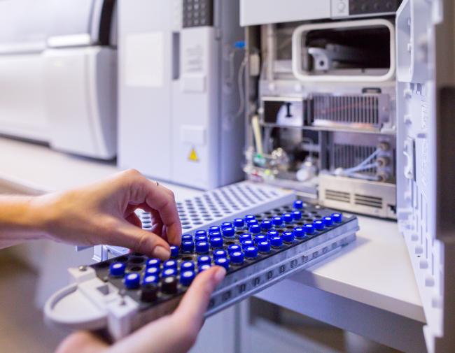 Lab scientist prepares samples for analysis using mass spectrometry.