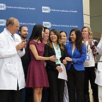 Nina Pham, family members and doctors outside the Clinical Center.