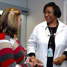 A doctor speaks to her patient.