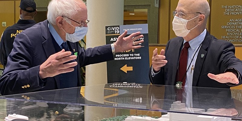 Senator Bernie Sanders visited the NIH Clinical Center in January 2023. He is photographed here visiting a model of the NIH Clinical Center with Dr. James Gilman, the CEO of the NIH Clinical Center. 