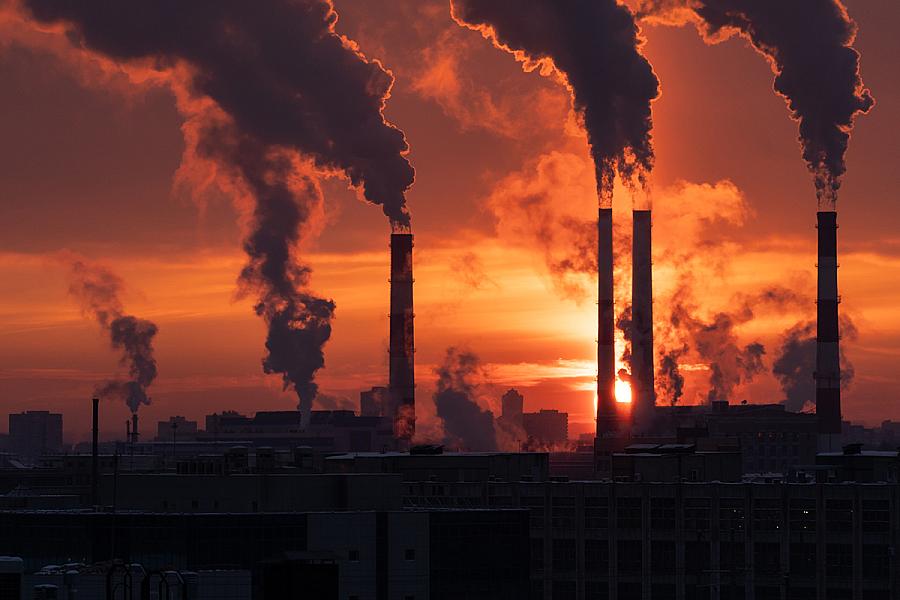  Downloaded Smoke from heating station in big city during winter season at sunset. Smokestack pipes emitting co2 from coal thermal power plant into atmosphere.