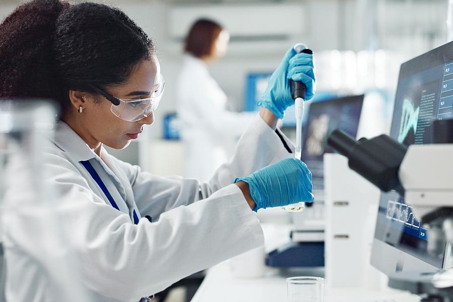 Test tubes, dropper and woman scientist in laboratory for medical study, research or experiment. Glass vials, pipette and professional female person with chemical liquid for pharmaceutical innovation