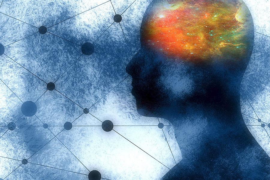 Silhouette of a man’s head with orange color-coding representing the brain.