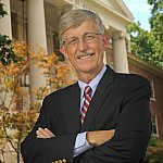 Portrait of Dr. Francis Collins standing in front of Building One