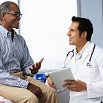 A man talking with his doctor