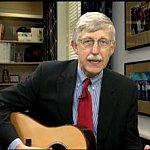 Dr. Collins playing his guitar.