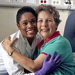 A nurse embraces a cancer patient.