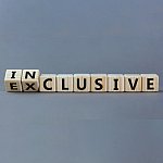 Cubes spelling out the word exclusive changing to inclusive