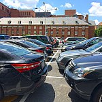 Parking lot filled with cars on the NIH campus.