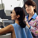 Woman receiving a mammography.