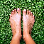 Bare feet on top of grass