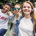 Three smiling teenagers