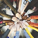 A group of diverse hands together