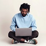 A man looking at a laptop