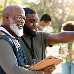 A senior man doing volunteer work with his community